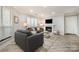 Bright living room with stylish furniture, modern fireplace, and wood-look floors at 8135 Cedar Glen Dr, Charlotte, NC 28212