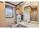Bathroom showcasing an antique vanity, tub/shower combo, window, and decorative wallpaper at 8706 Richardson King Rd, Waxhaw, NC 28173