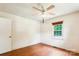 Bright bedroom features a ceiling fan, natural light, and wood-look floors at 8706 Richardson King Rd, Waxhaw, NC 28173