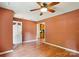 Inviting living room boasts hardwood floors, ceiling fan and fresh paint ready for your personal touch at 8706 Richardson King Rd, Waxhaw, NC 28173
