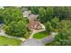 Beautiful brick home with lush landscaping, mature trees, and a circular driveway at 8918 Beach Bluff Ct, Sherrills Ford, NC 28673