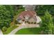 Stunning aerial view of brick home with lush landscaping and a curving driveway at 8918 Beach Bluff Ct, Sherrills Ford, NC 28673