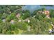 Stunning aerial view of lakeside homes surrounded by lush greenery and sparkling water at 8918 Beach Bluff Ct, Sherrills Ford, NC 28673
