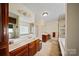 Well-appointed bathroom with double vanity, tile floors, separate shower, and soaking tub at 8918 Beach Bluff Ct, Sherrills Ford, NC 28673