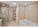 Bathroom with tub and a glass door shower, fully tiled at 8918 Beach Bluff Ct, Sherrills Ford, NC 28673