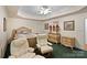 Cozy bedroom with chair, furniture set, soft carpet and tray ceiling at 8918 Beach Bluff Ct, Sherrills Ford, NC 28673