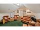 Comfortable bonus room features a wet bar area, an open ceiling and leather sofas at 8918 Beach Bluff Ct, Sherrills Ford, NC 28673