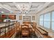 Elegant dining room featuring tray ceilings, stylish chandelier, and kitchen access at 8918 Beach Bluff Ct, Sherrills Ford, NC 28673