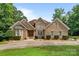 Charming brick home featuring manicured landscaping and a welcoming entrance at 8918 Beach Bluff Ct, Sherrills Ford, NC 28673