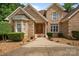 Charming brick home featuring manicured landscaping and a welcoming entrance at 8918 Beach Bluff Ct, Sherrills Ford, NC 28673