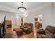 Bright and inviting living room with hardwood floors and access to the dining room at 8918 Beach Bluff Ct, Sherrills Ford, NC 28673