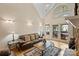 Bright living room with doors leading to an outdoor patio, hardwood floors and modern lighting at 8918 Beach Bluff Ct, Sherrills Ford, NC 28673