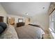 A comfortable main bedroom features a window and a wooden dresser with a mirror at 8918 Beach Bluff Ct, Sherrills Ford, NC 28673