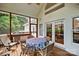 Screened in porch with outdoor furniture set at 8918 Beach Bluff Ct, Sherrills Ford, NC 28673