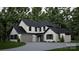 Beautiful exterior elevation featuring a modern design with stone accents, black trim, and an attached garage at 10220 Idlewild Rd, Matthews, NC 28105