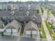 Overhead view of home showcasing its garages, brick exterior, and proximity to neighborhood at 11546 Red Rust Ln, Charlotte, NC 28277