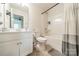 Bathroom with white cabinets, a mirror, a shower, tile flooring, and modern fixtures at 11546 Red Rust Ln, Charlotte, NC 28277