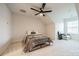 Bedroom with a ceiling fan, neutral walls, carpeted floors, and a comfortable bed at 11546 Red Rust Ln, Charlotte, NC 28277