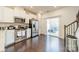 Modern kitchen with stainless steel appliances and sliding glass door to the outdoor space at 11546 Red Rust Ln, Charlotte, NC 28277