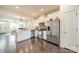 Well-lit kitchen featuring stainless steel appliances and open layout to living area at 11546 Red Rust Ln, Charlotte, NC 28277