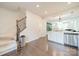 Open concept kitchen with stainless steel appliances and view into the living room at 11546 Red Rust Ln, Charlotte, NC 28277