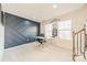 Bright office with a modern desk, stylish accent wall, and natural light from two large windows at 11546 Red Rust Ln, Charlotte, NC 28277