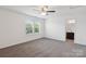 Bedroom with large windows, ceiling fan, and carpet at 117 Carmine Ct, Troutman, NC 28166