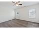 Spacious carpeted bedroom with ceiling fan and windows offering plenty of natural light at 117 Carmine Ct, Troutman, NC 28166