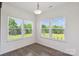 Dining nook with large windows overlooking a green backyard at 117 Carmine Ct, Troutman, NC 28166