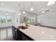 Open kitchen featuring a white quartz island and ample natural light from surrounding windows at 117 Carmine Ct, Troutman, NC 28166