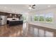 Spacious kitchen with stainless steel appliances, island with pendant lighting, and hardwood floors at 117 Carmine Ct, Troutman, NC 28166
