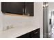 Kitchen countertop featuring modern decor and stainless steel appliances at 117 Carmine Ct, Troutman, NC 28166