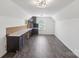 Bright bonus room with built-in desk and hardwood floors at 117 Carmine Ct, Troutman, NC 28166