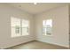 Bright bedroom with wood-look floors and two windows providing ample natural light at 1266 Langston Ln, Salisbury, NC 28144