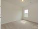 Bright bedroom with neutral carpet, a window, and white walls at 1266 Langston Ln, Salisbury, NC 28144