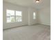 Spacious bedroom with two windows offering neighborhood views and plush carpeting at 1266 Langston Ln, Salisbury, NC 28144