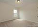 Bright bedroom with neutral carpet, a window, and white walls at 1266 Langston Ln, Salisbury, NC 28144
