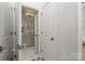 Bright hallway bathroom featuring modern fixtures, a marble floor, and neutral tones, great for freshening up at 1315 East Blvd # 225, Charlotte, NC 28203