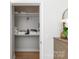 Bright closet space featuring built-in shelving, providing ample storage, and hardwood floors, perfect for organizing at 1315 East Blvd # 225, Charlotte, NC 28203