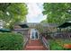 Charming commercial building with outdoor seating, and lush greenery in a vibrant neighborhood setting at 1315 East Blvd # 225, Charlotte, NC 28203