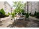 A tranquil courtyard with benches and lush greenery, creating a relaxing outdoor space at 1315 East Blvd # 225, Charlotte, NC 28203