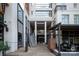 Welcoming entrance to The Dilworth building, featuring a grand staircase and outdoor seating at 1315 East Blvd # 225, Charlotte, NC 28203