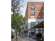 Charming brick and white condominium building with attractive signage and sidewalk access at 1315 East Blvd # 225, Charlotte, NC 28203