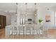 Bright kitchen with large island, stainless steel appliances, and stylish pendant lighting at 1315 East Blvd # 225, Charlotte, NC 28203