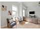 Bright living area featuring hardwood floors, stylish seating, and large windows, great for relaxing or entertaining at 1315 East Blvd # 225, Charlotte, NC 28203
