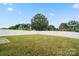 Spacious backyard features a lush lawn and a pristine white privacy fence, perfect for outdoor enjoyment at 1343 Kent Downs Sw Ave, Concord, NC 28027