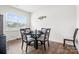 Cozy dining area with a modern table and chairs, filled with natural light at 1343 Kent Downs Sw Ave, Concord, NC 28027