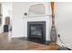 Elegant fireplace with decorative mantel and modern gas insert at 1343 Kent Downs Sw Ave, Concord, NC 28027