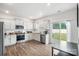 Modern kitchen featuring stainless steel appliances, ample counter space, and bright lighting at 1343 Kent Downs Sw Ave, Concord, NC 28027
