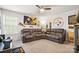 Spacious living room featuring a large sectional sofa and decorative Steelers memorabilia at 1343 Kent Downs Sw Ave, Concord, NC 28027